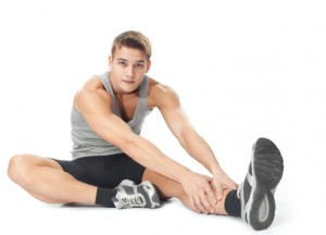 Athlete man doing stretches exercises